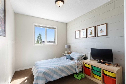 590 Coopers Drive Sw, Airdrie, AB - Indoor Photo Showing Bedroom
