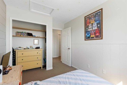 590 Coopers Drive Sw, Airdrie, AB - Indoor Photo Showing Bedroom