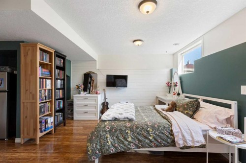 590 Coopers Drive Sw, Airdrie, AB - Indoor Photo Showing Bedroom