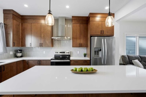 52 Emberside Grove, Cochrane, AB - Indoor Photo Showing Kitchen With Stainless Steel Kitchen