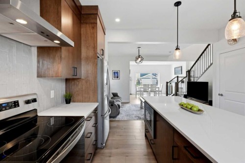 52 Emberside Grove, Cochrane, AB - Indoor Photo Showing Kitchen With Upgraded Kitchen
