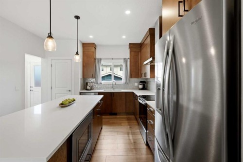 52 Emberside Grove, Cochrane, AB - Indoor Photo Showing Kitchen With Stainless Steel Kitchen With Upgraded Kitchen