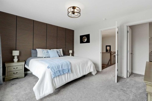 52 Emberside Grove, Cochrane, AB - Indoor Photo Showing Bedroom