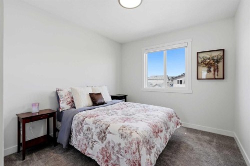 52 Emberside Grove, Cochrane, AB - Indoor Photo Showing Bedroom