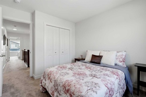 52 Emberside Grove, Cochrane, AB - Indoor Photo Showing Bedroom
