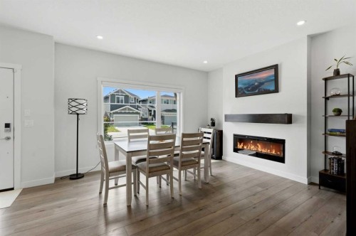 52 Emberside Grove, Cochrane, AB - Indoor With Fireplace