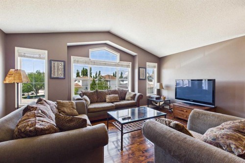 147 Tuscany Meadows Court Nw, Calgary, AB - Indoor Photo Showing Living Room