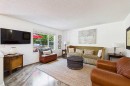 147 Tuscany Meadows Court Nw, Calgary, AB  - Indoor Photo Showing Living Room 