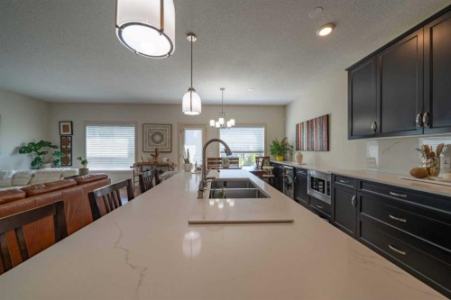 144 Everhollow Street Sw, Calgary, AB - Indoor Photo Showing Kitchen With Double Sink With Upgraded Kitchen