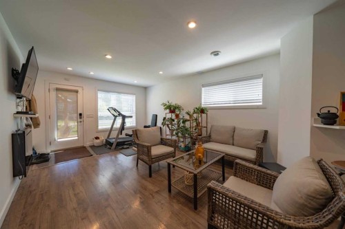 144 Everhollow Street Sw, Calgary, AB - Indoor Photo Showing Living Room