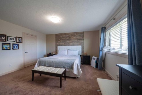 144 Everhollow Street Sw, Calgary, AB - Indoor Photo Showing Bedroom
