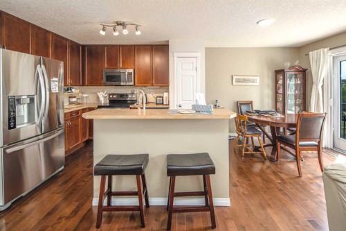 125 Silverado Range Cove Sw, Calgary, AB - Indoor Photo Showing Kitchen With Stainless Steel Kitchen