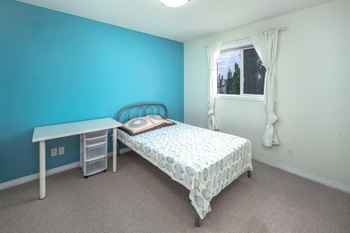 125 Silverado Range Cove Sw, Calgary, AB - Indoor Photo Showing Bedroom