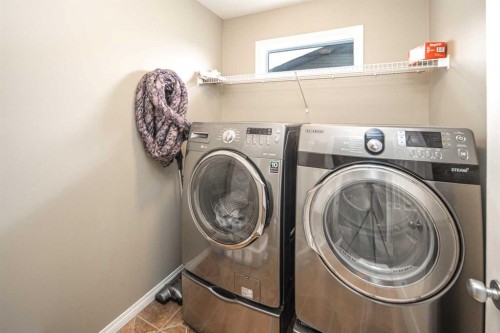125 Silverado Range Cove Sw, Calgary, AB - Indoor Photo Showing Laundry Room