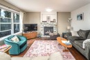 125 Silverado Range Cove Sw, Calgary, AB  - Indoor Photo Showing Living Room With Fireplace 