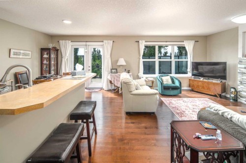 125 Silverado Range Cove Sw, Calgary, AB - Indoor Photo Showing Living Room With Fireplace