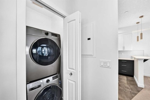 113-1005A Westmount Drive, Strathmore, AB - Indoor Photo Showing Laundry Room