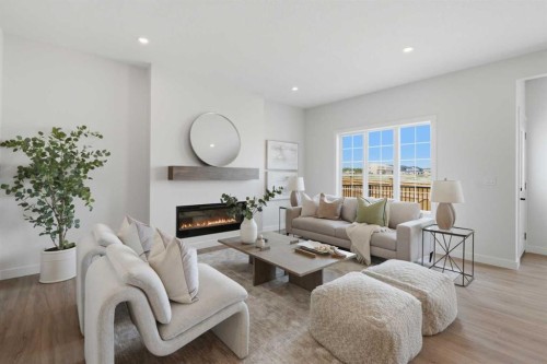 27 Verdure Gate Sw, Calgary, AB - Indoor Photo Showing Living Room With Fireplace
