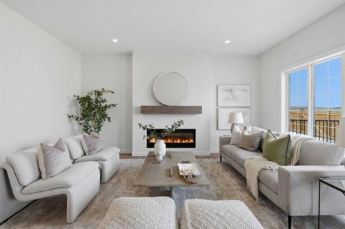 27 Verdure Gate Sw, Calgary, AB - Indoor Photo Showing Living Room With Fireplace