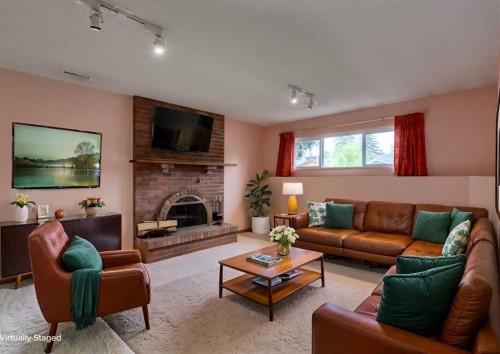 9527 Oakland Way Sw, Calgary, AB - Indoor Photo Showing Living Room With Fireplace