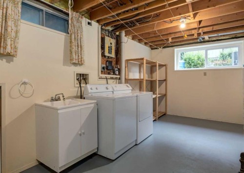 9527 Oakland Way Sw, Calgary, AB - Indoor Photo Showing Laundry Room