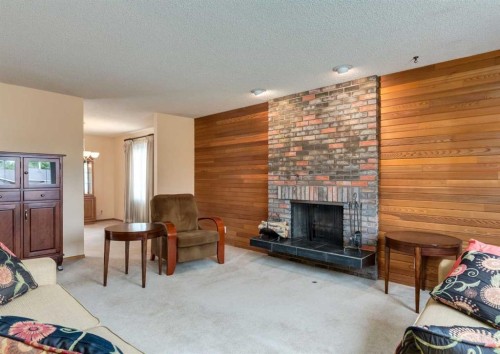 9527 Oakland Way Sw, Calgary, AB - Indoor With Fireplace