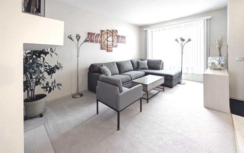 12 Shawbrooke Court Sw, Calgary, AB - Indoor Photo Showing Living Room