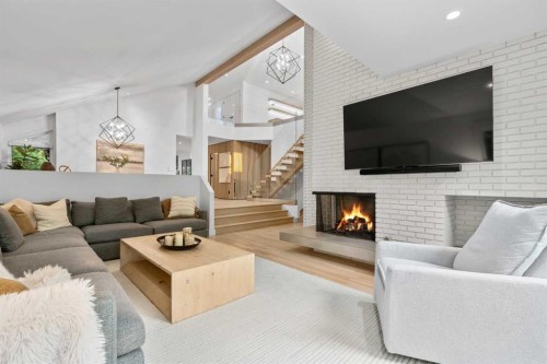 3041 1 Street Sw, Calgary, AB - Indoor Photo Showing Living Room With Fireplace