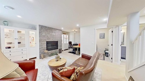 7 Bridlecrest Boulevard Sw, Calgary, AB - Indoor Photo Showing Living Room With Fireplace