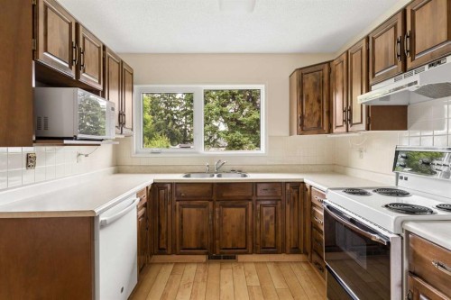 604 Foritana Road Se, Calgary, AB - Indoor Photo Showing Kitchen With Double Sink