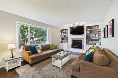 70 Coventry Crescent Ne, Calgary, AB - Indoor Photo Showing Living Room With Fireplace