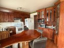 6803 Dalmeny Gate Nw, Calgary, AB  - Indoor Photo Showing Kitchen 