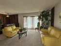 6803 Dalmeny Gate Nw, Calgary, AB  - Indoor Photo Showing Living Room 