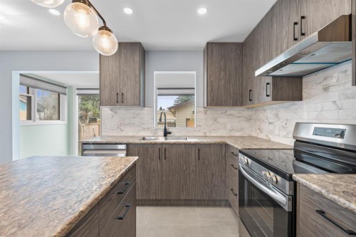 9408 5 Street Se, Calgary, AB - Indoor Photo Showing Kitchen With Double Sink With Upgraded Kitchen