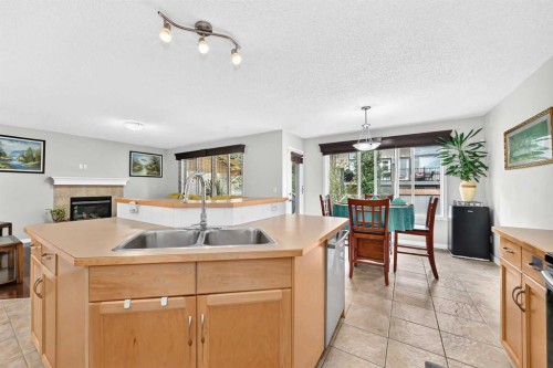 53 Everhollow Park Sw, Calgary, AB - Indoor Photo Showing Kitchen With Double Sink