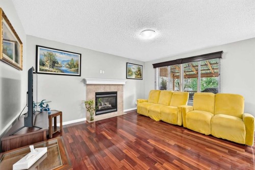 53 Everhollow Park Sw, Calgary, AB - Indoor Photo Showing Living Room With Fireplace