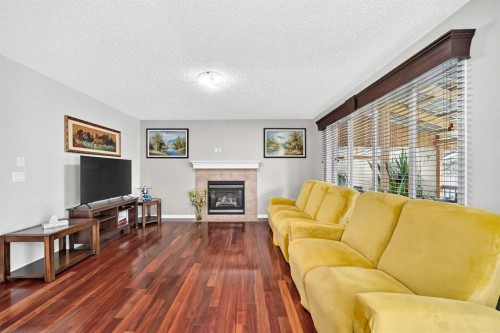 53 Everhollow Park Sw, Calgary, AB - Indoor Photo Showing Living Room With Fireplace