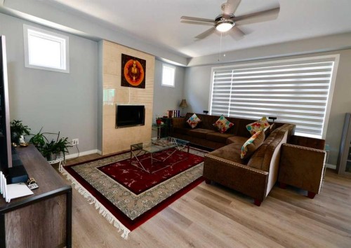 163 Cityside Park Ne, Calgary, AB - Indoor Photo Showing Living Room With Fireplace
