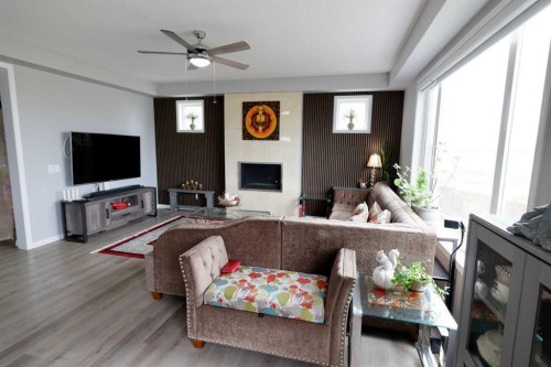 163 Cityside Park Ne, Calgary, AB - Indoor Photo Showing Living Room With Fireplace