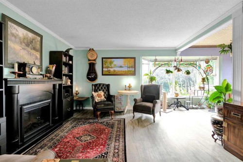 3722 Dover Ridge Drive Se, Calgary, AB - Indoor Photo Showing Living Room With Fireplace