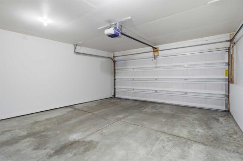 3032 New Brighton Gardens Se, Calgary, AB - Indoor Photo Showing Garage
