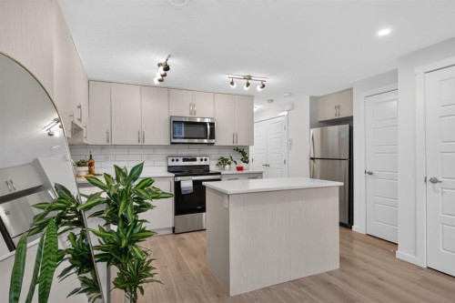 461 Cranbrook Square Se, Calgary, AB - Indoor Photo Showing Kitchen With Upgraded Kitchen