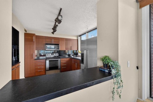 1607-145 Point Drive Nw, Calgary, AB - Indoor Photo Showing Other Room