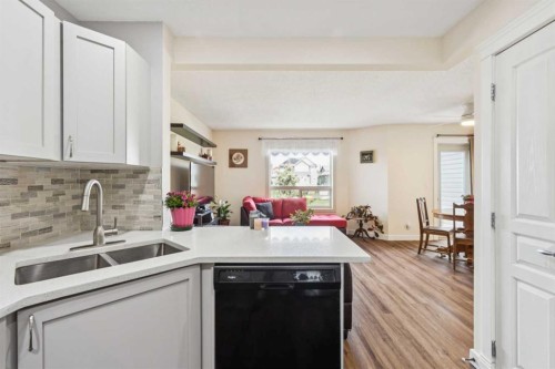 212 Bayside Point Sw, Airdrie, AB - Indoor Photo Showing Kitchen With Double Sink