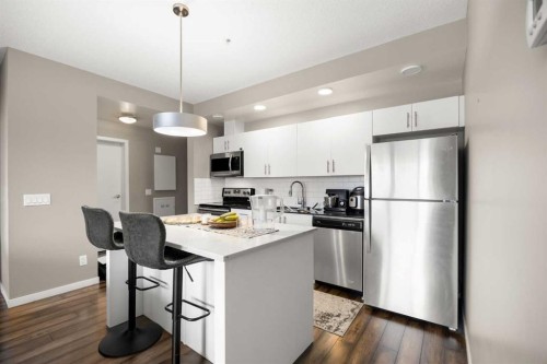 208-4818 Varsity Drive Nw, Calgary, AB - Indoor Photo Showing Kitchen With Stainless Steel Kitchen With Upgraded Kitchen