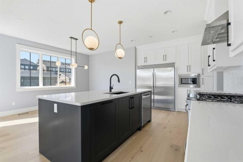 1209 Coopers Drive Sw, Airdrie, AB - Indoor Photo Showing Kitchen With Stainless Steel Kitchen With Upgraded Kitchen