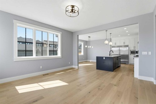 1209 Coopers Drive Sw, Airdrie, AB - Indoor Photo Showing Kitchen