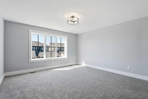1209 Coopers Drive Sw, Airdrie, AB - Indoor Photo Showing Other Room