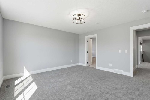 1209 Coopers Drive Sw, Airdrie, AB - Indoor Photo Showing Other Room