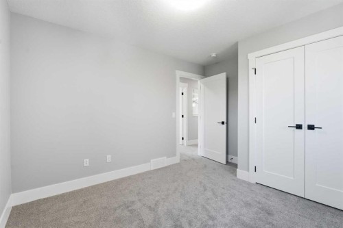 1209 Coopers Drive Sw, Airdrie, AB - Indoor Photo Showing Other Room